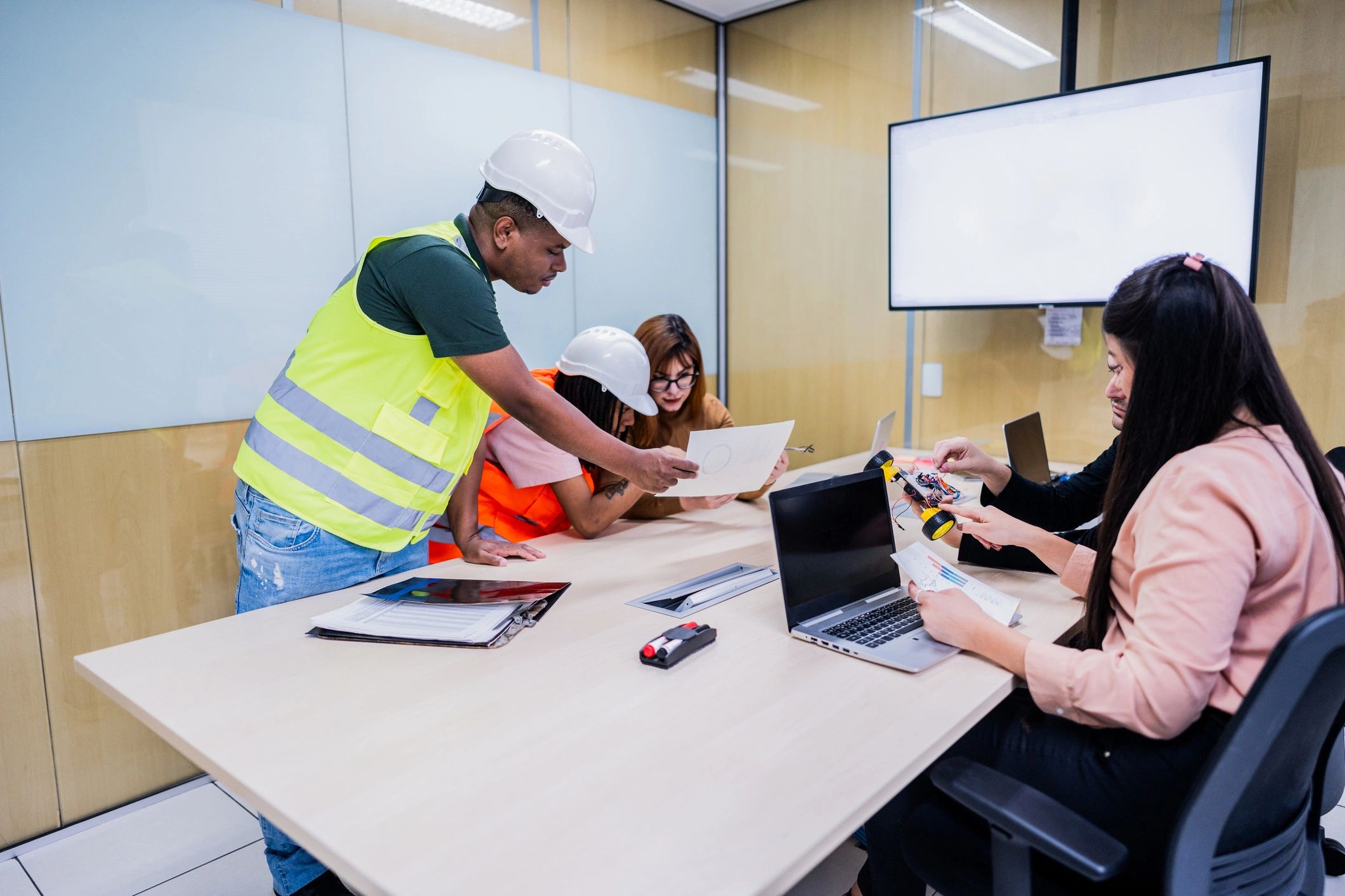 Engineers and project stakeholders in a coordination meeting