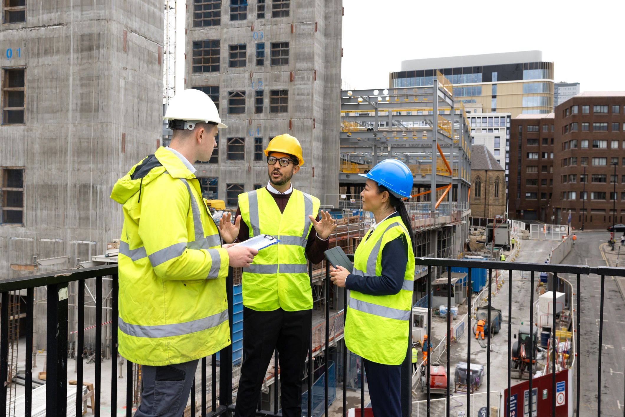 Construction team reviewing plans and schedule at an active jobsite